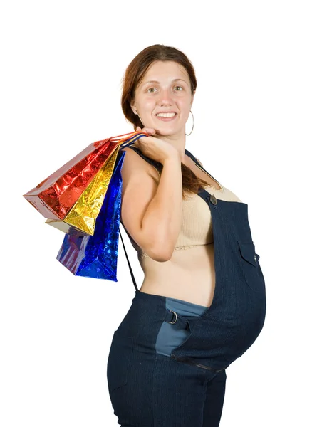 Zwanger vrouw met boodschappentassen — Stockfoto