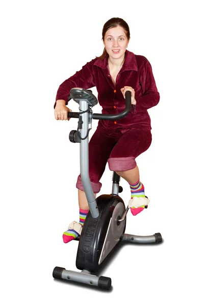 Sabit bisiklet üzerinde egzersiz kız — Stok fotoğraf