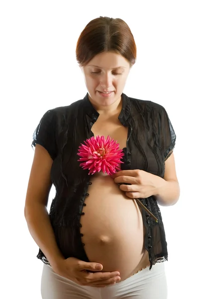 Kobieta w ciąży z kwiatem — Zdjęcie stockowe