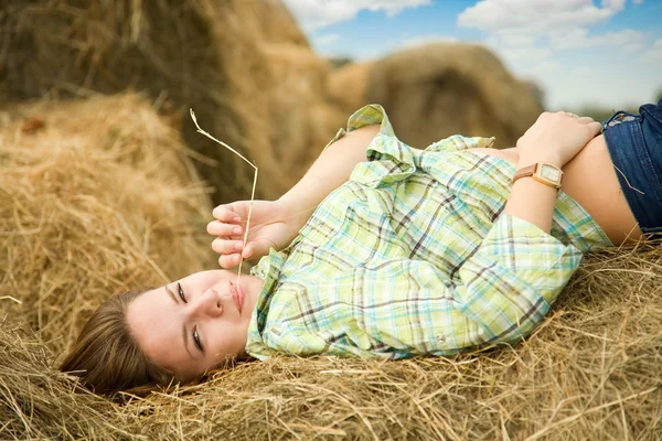 Girl enjoying on hay — Stock Photo, Image