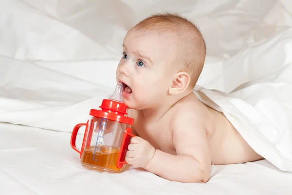 Little girl with baby bottle — Stock Photo, Image