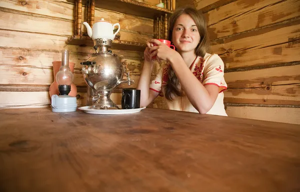 Girl having tea — Stock Photo, Image