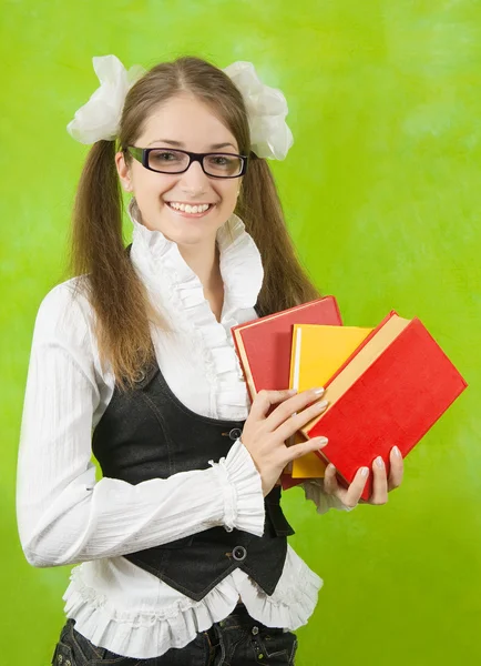 Schoolgirl in glasses with books — Stock Photo, Image