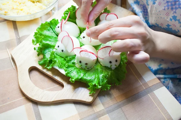 stock image Woman is decorating stuffed eggs