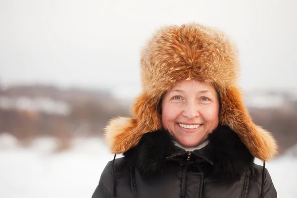 Happy mature woman in winter Stock Photo