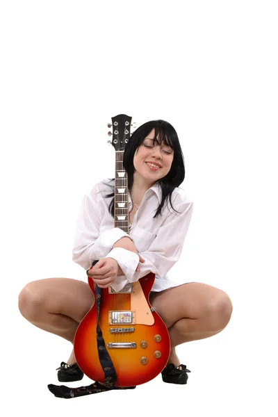 The girl loves a guitar — Stock Photo, Image