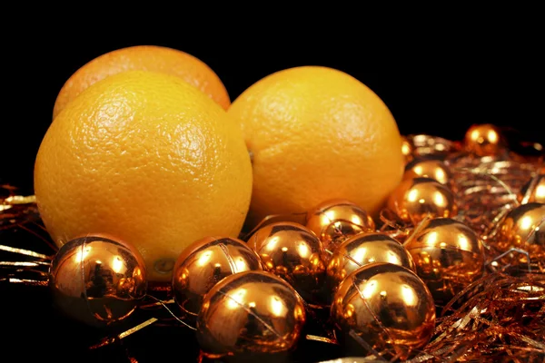 Sinaasappelen en goud Stockfoto