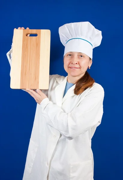 Woman holding cutting board — Stock Photo, Image