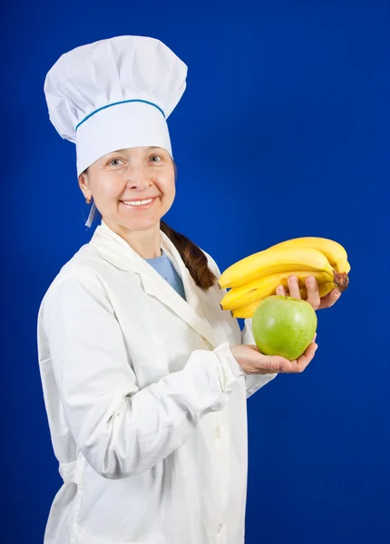 Cocinar tomados de la mano de plátanos y manzana — Foto de Stock