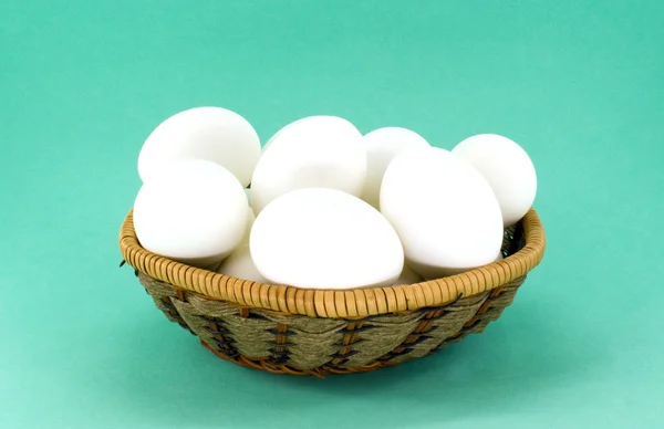 Eggs in wicker basket — Stock Photo, Image