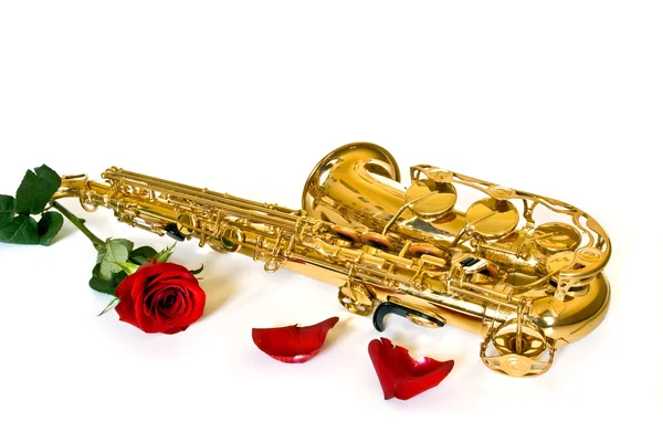 Saxofon a růže — Stock fotografie