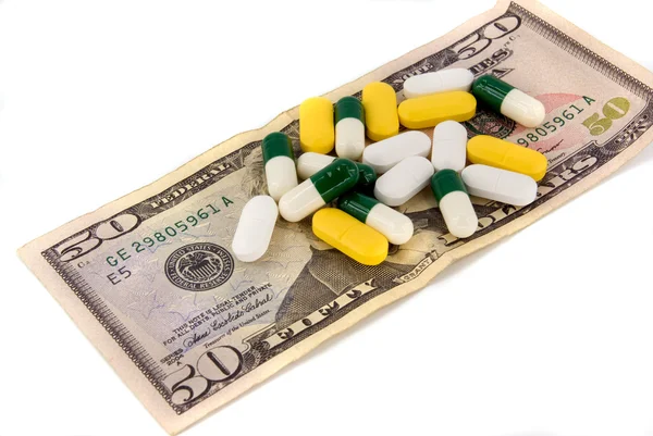 Píldoras y dinero —  Fotos de Stock