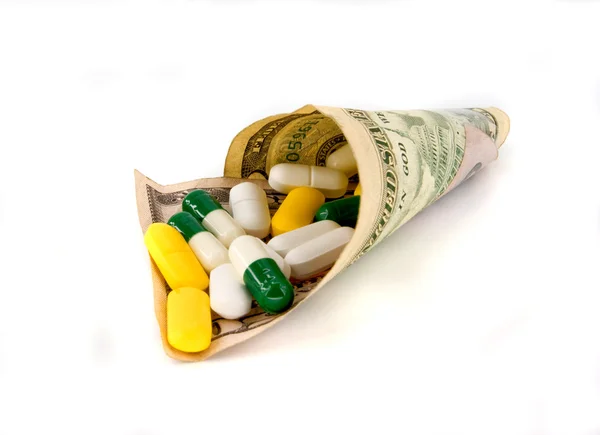 Pillole e denaro — Foto Stock