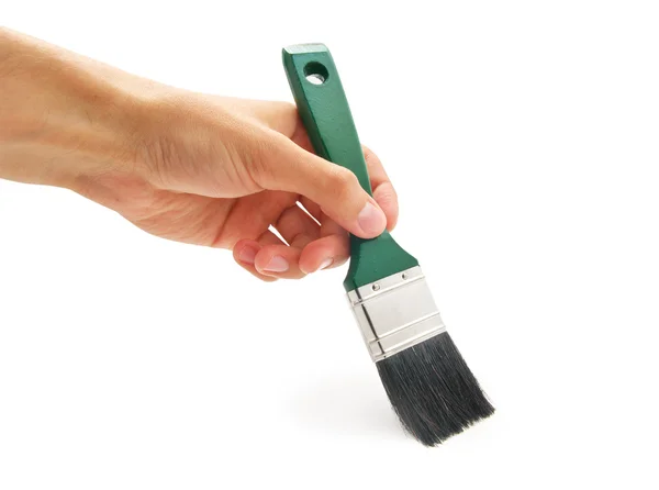 Hand with green brush — Stock Photo, Image
