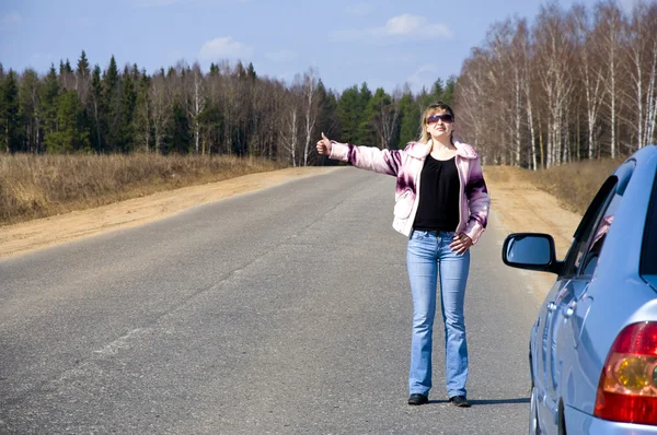 stock image R girl hitchhiking on the