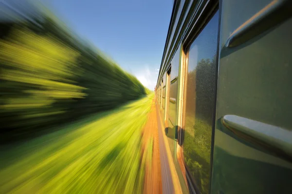 Fast riding a train with motion blur — Stock Photo, Image