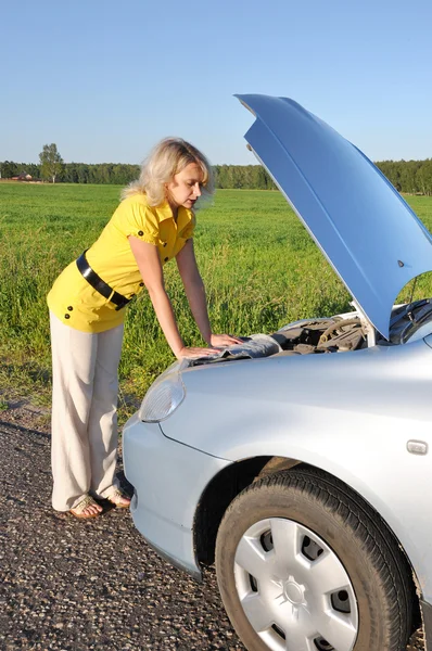 stock image Young woman in her car breaks down. Engine failure