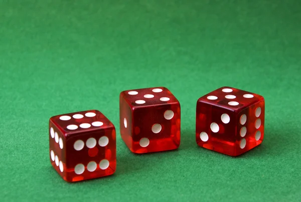 stock image Set of three dice on green