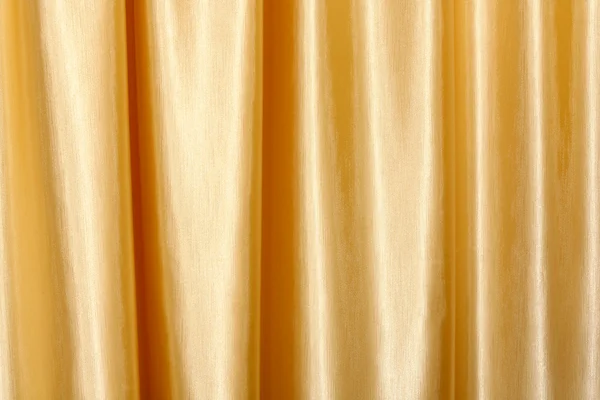 พื้นหลังของผ้าสีทอง — ภาพถ่ายสต็อก
