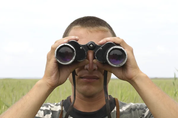 stock image A border war is looking through binoculars