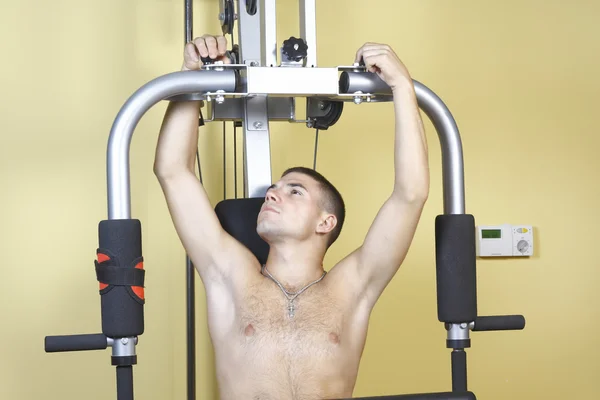 stock image A young man sets up simulator