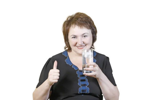 Yaşlı kadın bir bardak su ile — Stok fotoğraf