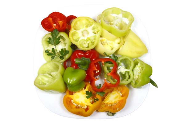 Sweet pepper chopped multicolored on a plate — Stock Photo, Image