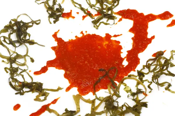 Blot of tomato sauce with sea kale — Stock Photo, Image
