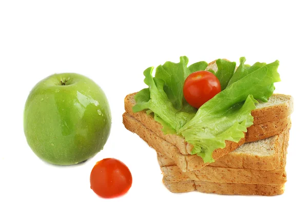 Яблоко, овощи и хлеб — стоковое фото