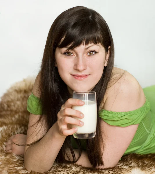 Young woman with milk — Stock Photo, Image