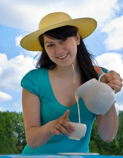 Woman with jug of the milk — Stock Photo, Image