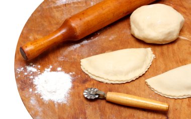 Rolling-pin with patty and pastry clipart