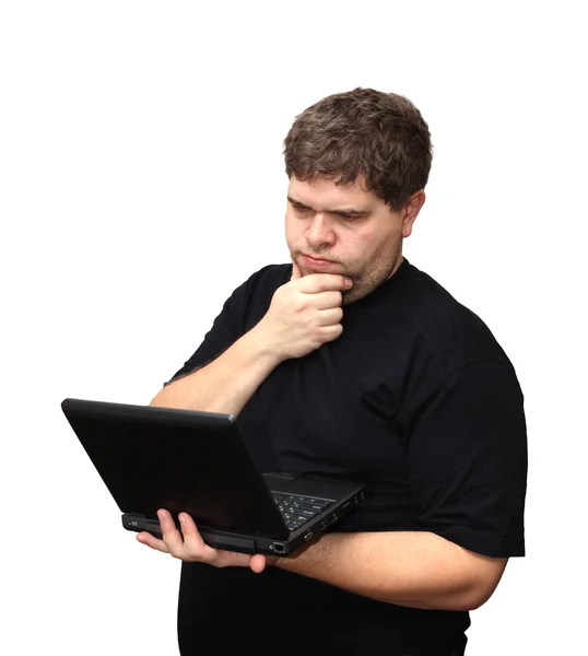 Denkender Mann mit Laptop — Stockfoto