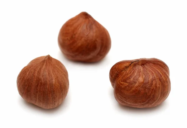 Three clear hazelnuts — Stock Photo, Image