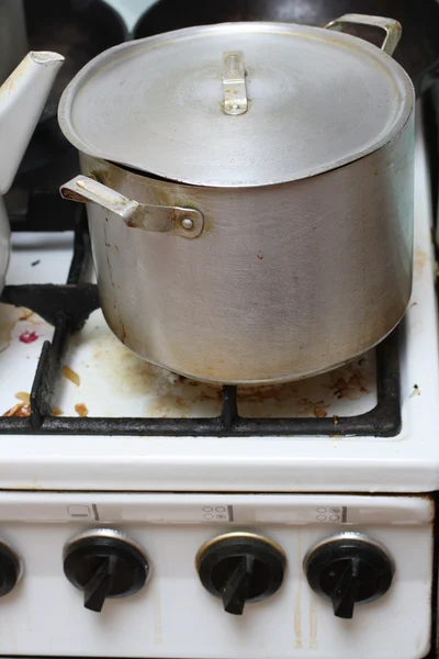 Pan on old dirty gas stove — Stock Photo, Image