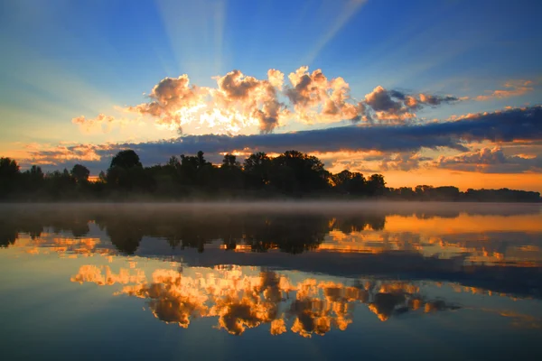 Sunrise and reflection in river — Stock Photo, Image