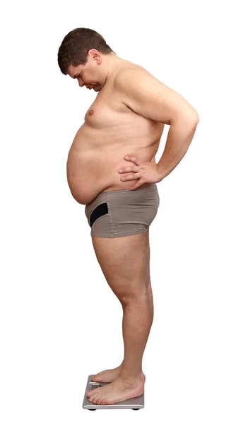 Homem com excesso de peso em balanças — Fotografia de Stock