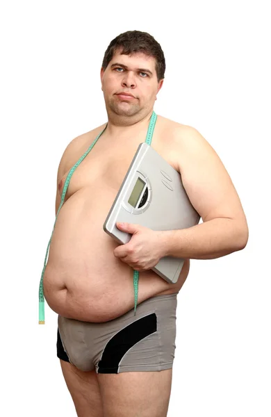 Толстяк с весами — стоковое фото