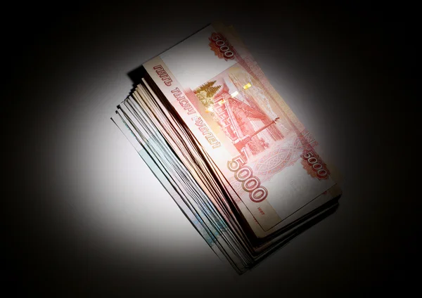 Russian rubles in light spot — Stock Photo, Image