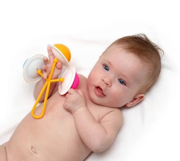 Baby girl with rattle — Stock Photo, Image