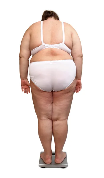 Женщины с избыточным весом сзади на весах — стоковое фото