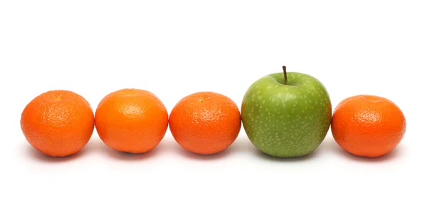 Different concepts with mandarins and apple — Stock Photo, Image