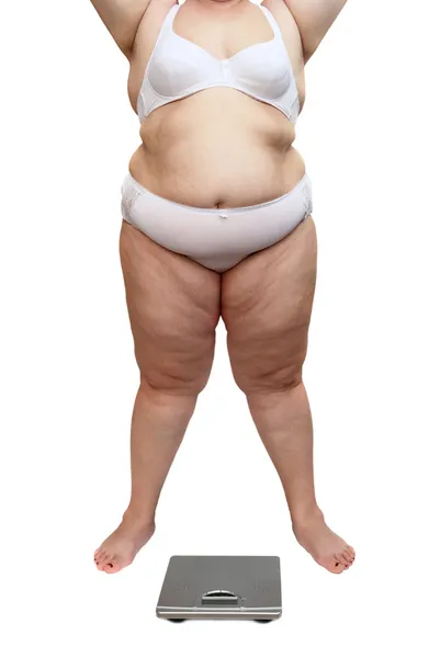 Overweight woman body and scales — Stock Photo, Image