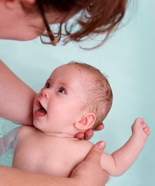 Happy baby girl bath by mother — Stock Photo, Image