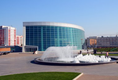 Modern glass building and fountain clipart