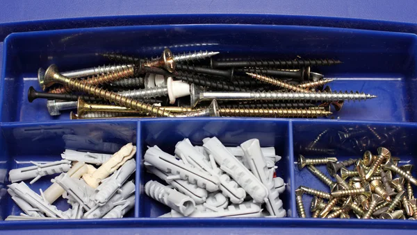 Toolbox with screws and dowels — Stock Photo, Image