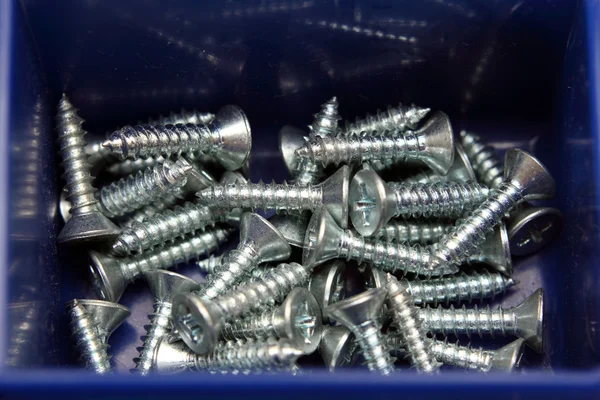 Little screws in box — Stock Photo, Image
