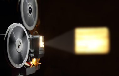 Old projector showing film clipart