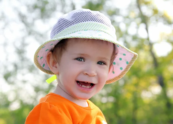 Laughing baby in hat outdoor — Stock Photo, Image