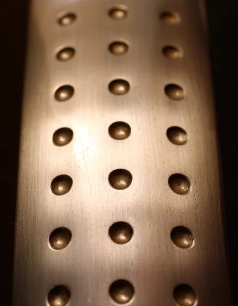 Spherical metal surface background with holes — Stock Photo, Image
